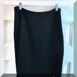 H43. Black skirt by DRAMA with front zipper slit. Size 6 - $24 